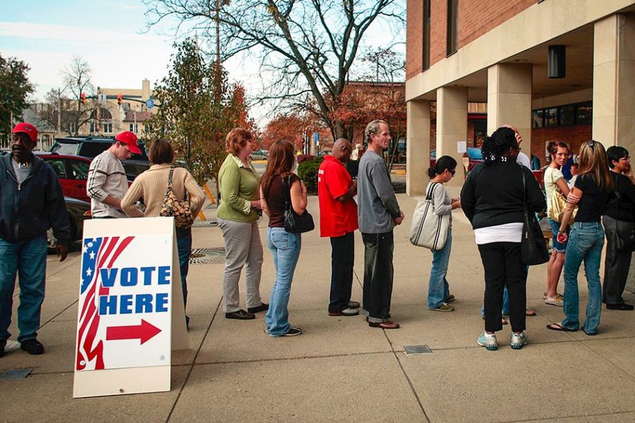 People wait in line to vote (Photo: AP)
