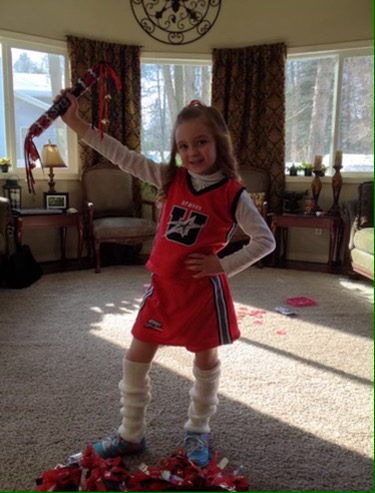 Young Emilee dressed and ready for cheer. 