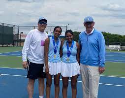 Ashi and Anni Amalnathan pose with their coaches and state medals.